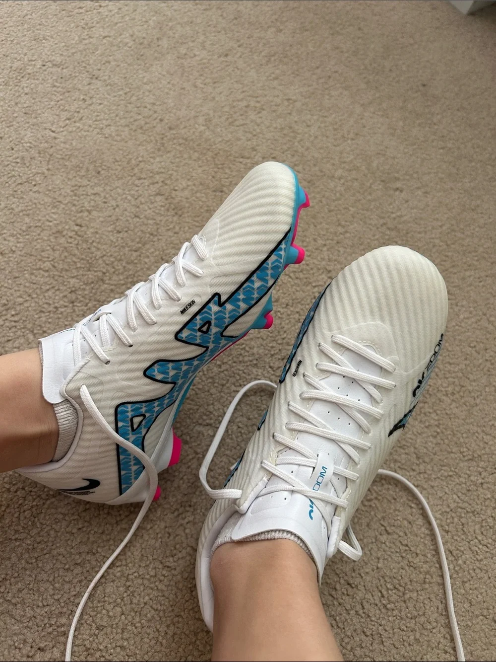 Nike Women's White Soccer Cleats with Blue Graphics and Pink Insole